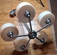 Top view of chandelier showing five radial arms and shades