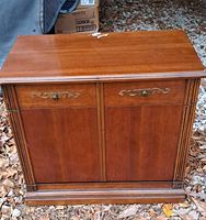 Front view of cabinet showing doors, pulls, trim, veneer surface