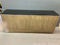 Front view of four-door wooden sideboard