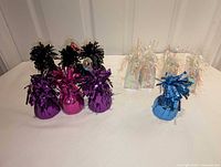 All eleven balloon weights arranged on table