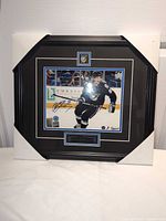 Front view of framed autographed photo