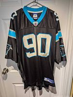 Front view showing #90, team colors, Reebok jock tag