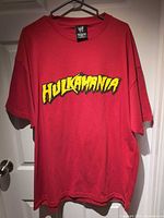 Front of red Hulkamania T-shirt on hanger