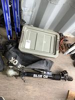 Complete view of Blue Ox tow bar, cover, and grey tote