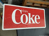 Full view of metal Coke sign