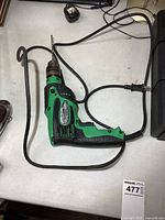 Full view of Hitachi corded hammer drill with cable