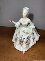 Front view of Royal Doulton Diana figurine showing pose and floral skirt