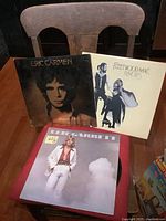 Front covers of the three LPs displayed together