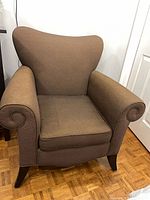 Front view of brown microfiber accent armchair
