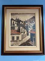 Full view of framed colonial village street scene painting
