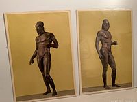 Both posters together in protective sleeves