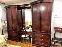 Full front view of wall unit showing both wardrobes, center vanity and mirror