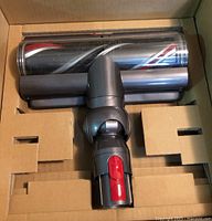 Top view of Dyson motorized cleaner head in box