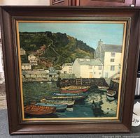 front view of framed harbour scene painting