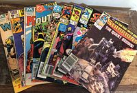All nine comics fanned out