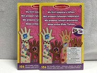 Front view of two sealed packs showing product title and designs