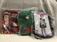 All three packaged costumes side by side