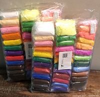 Three sealed packs of multicolour air-dry clay blocks