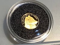 Encapsulated gold coin reverse showing fox, text CANADA 2016 25 CENTS