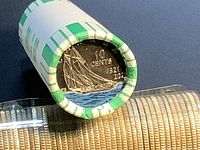 End view of roll showing colourized Bluenose dime with blue water