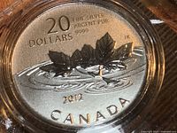 Obverse side showing denomination, purity, design and date