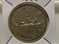Reverse of 1956 Canada silver dollar showing Voyageur design