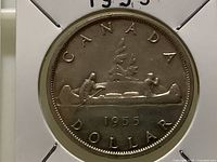 Reverse of 1955 Canada silver dollar showing Voyageur design