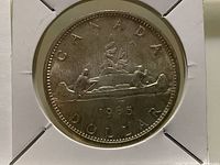 Reverse of 1965 Canadian silver dollar in holder
