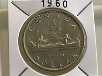 Reverse of 1960 Canadian silver dollar in holder