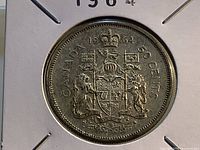 Reverse of 1964 Canadian 50-cent coin showing coat of arms