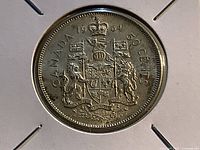 Reverse of 1964 Canadian 50 cent coin showing coat of arms