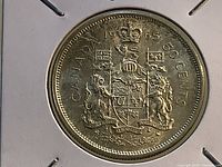 Reverse of 1950 Canadian 50-cent silver coin in cardboard flip