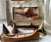 Overall lot showing wall art, canoe, three teepees