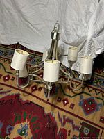 Chandelier with shades attached showing overall design