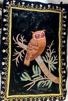 Full view of embroidered owl wall hanging showing entire design and border