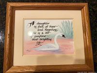 Front view of light oak wooden picture frame with mat and glass displaying artwork