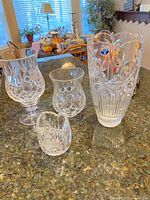 Four Bohemia cut crystal pieces on countertop