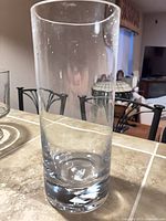 Full view of clear cylindrical glass vase