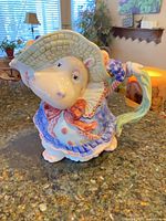 Front view of hippo canister showing multicolor glaze and overall form