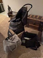 Stroller with two carriers on floor