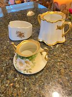 Front view of three porcelain pieces