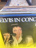Close-up of Elvis Presley Elvis In Concert LP at front of crate