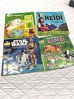 Front view of all four read-along book and record sets