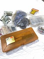 Overview of all fishing items including tackle boxes, rod holder, line spool, netting