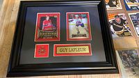 Front view of framed Lafleur cards and logo in black frame