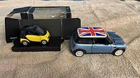 Mini Cooper and Smart Fortwo model cars side by side