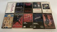 Front view of all ten cassette cases showing album art
