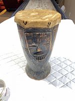 Full view of carved wooden drum