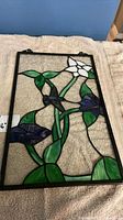 Framed hummingbird floral stained glass panel