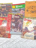 All six printed items spread on white surface